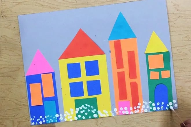幼儿园手工拼贴画《下雪后的房子》