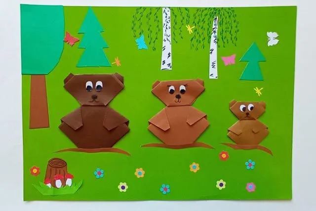 折纸拼贴画在森林里散步的小熊一家