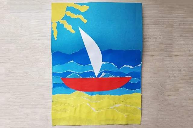简单手工撕纸贴画大海中的帆船